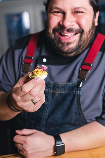 Chef Daniel Asher of River and Woods enjoying a Cannabis-Infused Miso Sriracha Deviled Egg featured in The Art of Cooking with Cannabis by Tracey Medeiros (Skyhorse Publishing, April 2021).