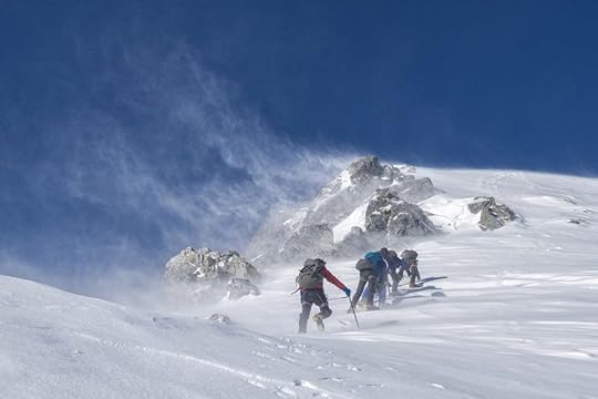 team of mountain climbers in snow
