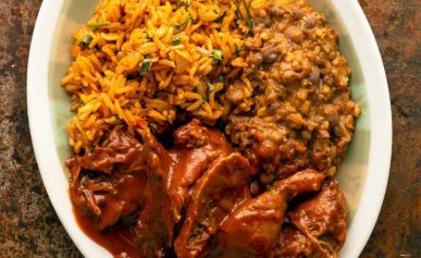 Sonoran carne con chile on a plate with rice and beans