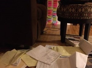 a bunch of papers and notes scattered across a floor