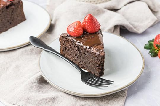 serving of a gluten free chocolate cake recipe on a plate with a fork