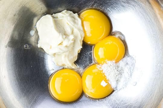 egg yolks and mayonnaise in a bowl for gluten free chocolate cake recipe