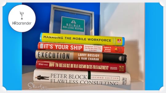 stack of books that every HR professional should own