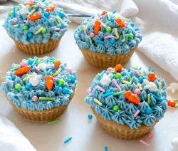 Four Vegan Vanilla Cupcakes with Blue coloured Buttercream Frosting