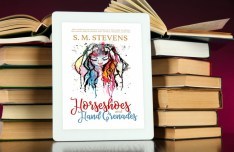 book on tablet against a stack of old hardcover books