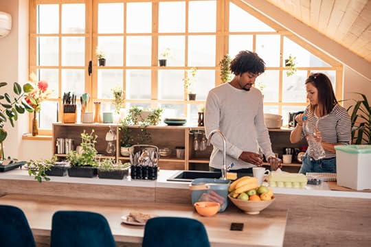couple in a sustainable kitchen with groceries