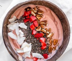 Coconut Bowl filled with PB&J smoothie and various toppings