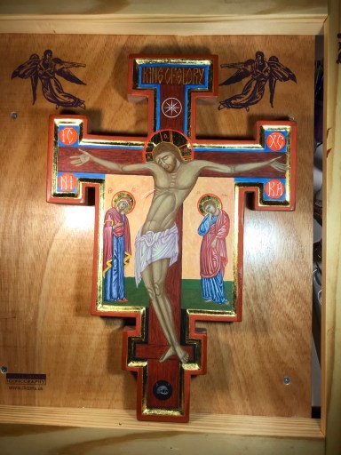 Image of a crucifix icon with rich jewel tones and gilding, with Christ crucified and the Mother of God weeping below him on the left and John the Beloved disciple mourning on the right. A skull is beneath Jesus’ feet