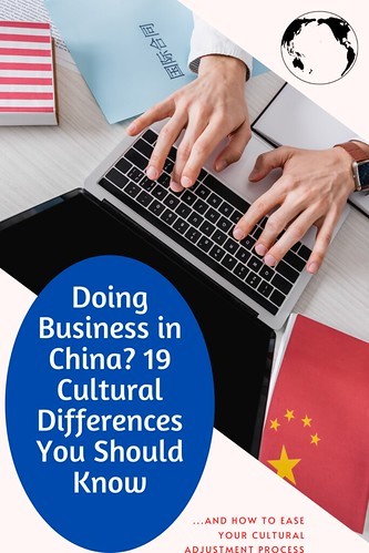 From Doing Business in China? 19 Cultural Differences You Should Know. Hands on a laptop, with USA and China flags and documents on the table. 