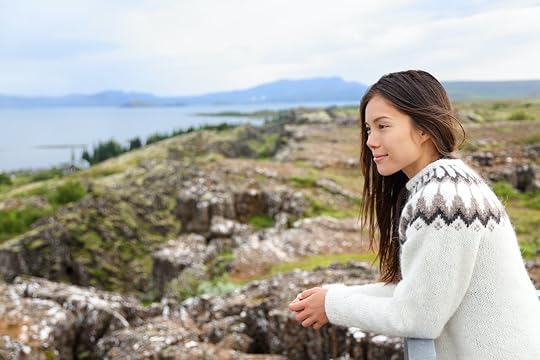 Iceland - woman in Icelandic sweater looking at Thingvellir place of Althing, the first parliament in the world. , Icelandic culture