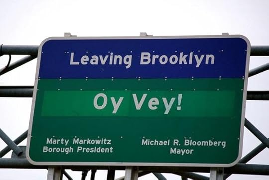 A picture containing text, sign, outdoor, skyDescription automatically generated