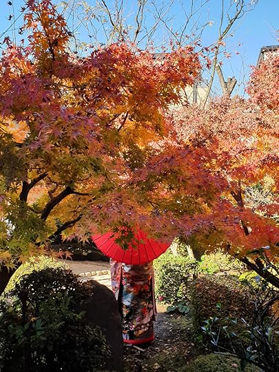 Kimono wearing woman with red parasol in Shibamata, Tokyo