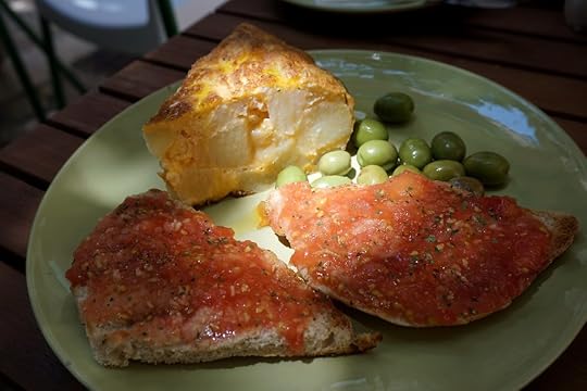 Tortilla slice and pan con tomate on a plate