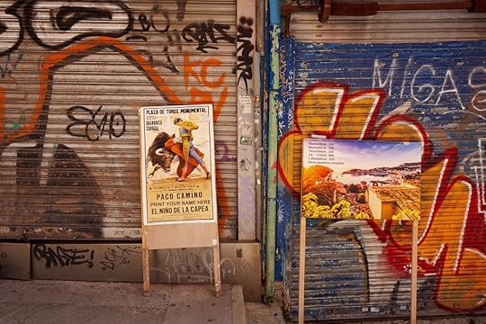 Bull fighting posters against graffitied shutters in Palma de Mallorca