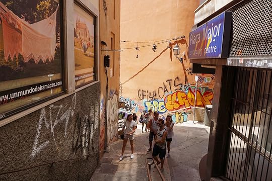 A group of young tourists in a sidestreet in Palma de Mallorca