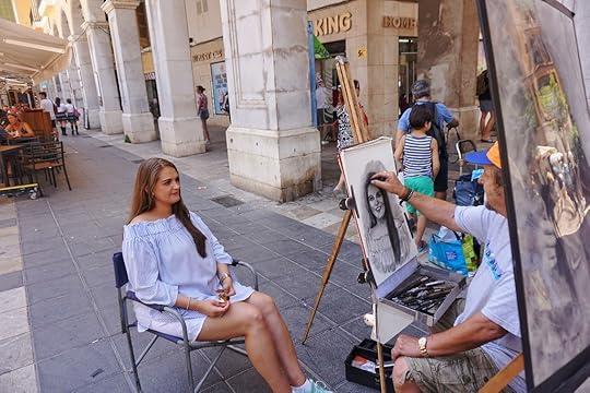 A street portrait artist in Plaza Mayor, Palma de Mallorca
