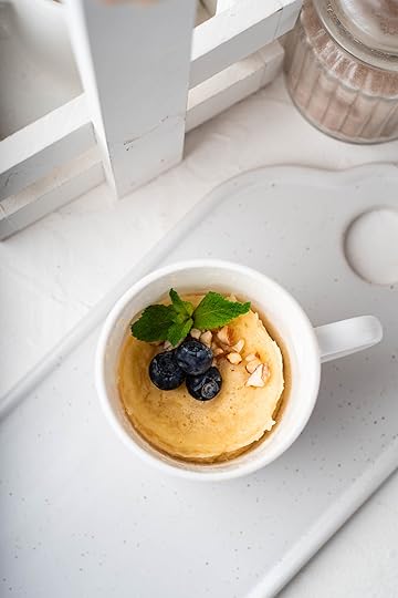 mug muffin topped with blueberries