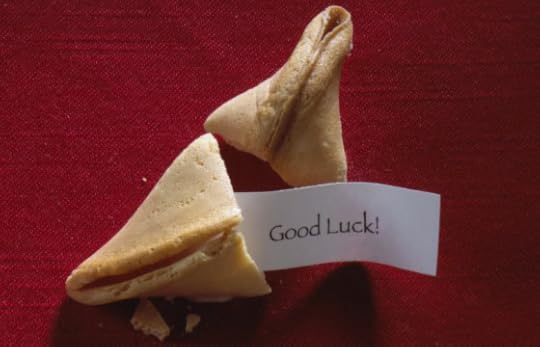 A broken fortune cookie with a message of 