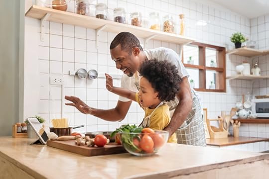 Father and little son cooking