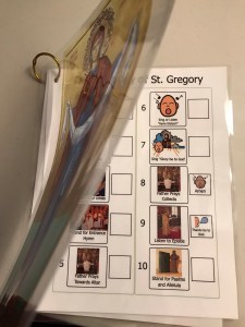 A sneak peek at the first page of the visual schedule for the Divine Liturgy of St. Gregory, with a transparent icon of the Theotokos lifted off most of the front page