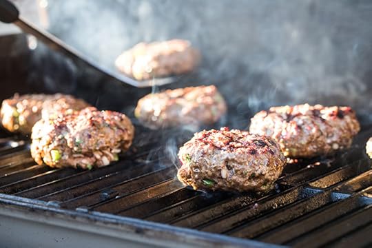 stuffed burgers on the grill for the cheddar stuffed burger with avocado with a lettuce wrap recipe