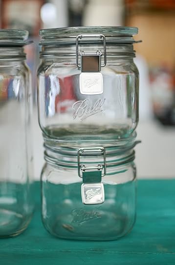Two empty, stacked smaller sized Ball Storage Latch Jars.