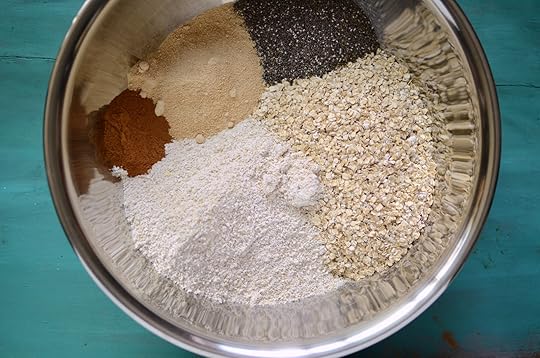 Quick oats, oat flour, maple sugar, chia seeds, and cinnamon in a large bowl, waiting to be stirred together to become homemade instant oats.
