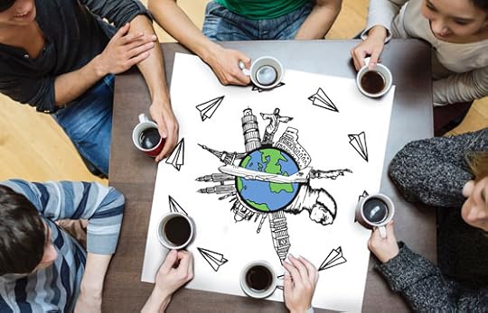 Top down view of a tabletop discussion between 6 people about travel and the benefits of a bilingual brain (Image © Eva Boynton)
