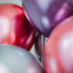 red and white balloons on white wall