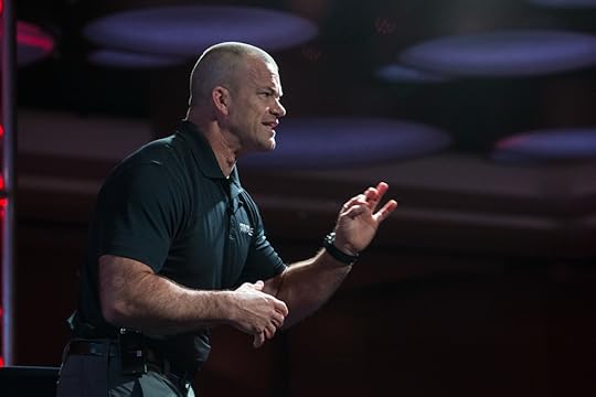Retired Navy SEAL Jocko Willink speaks onstage at a live event.