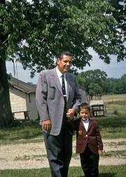 Author Don M. Winn with his father as a child in Colorado, outside in the garden, dressed in their nice suits.