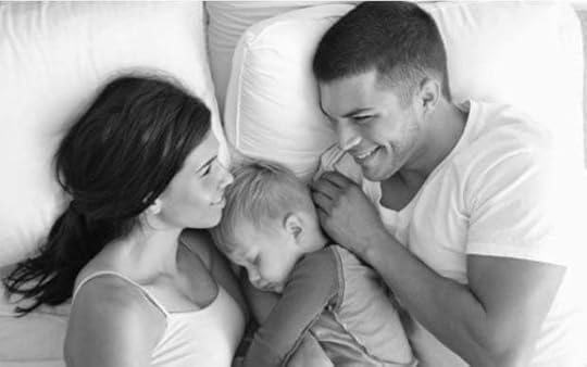 May be a black-and-white image of 2 people, child, indoor and text