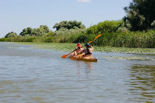 Tourists,Visiting,The,Danube,Delta,Delta,And,Its,Beauty, paddling the Danube Delta