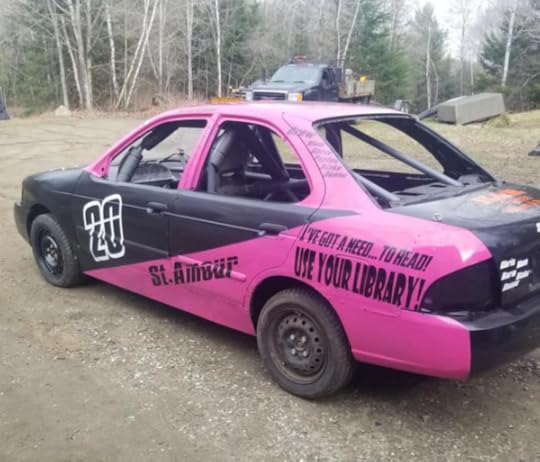 a black and pink stock car, number 20, with the caption 