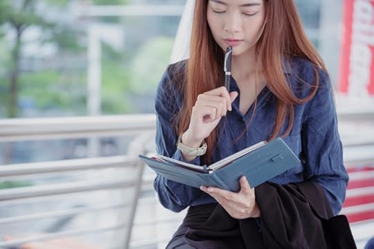 woman planning her calendar scheduling her fitness