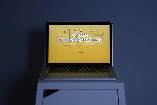 A laptop showing an under-construction page created with a WordPress plugin