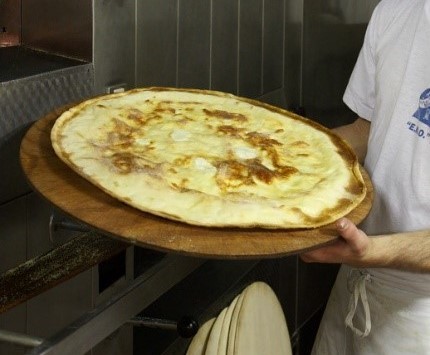 Ligurian cheese focaccia, another of Commissioner Daria Vinci's favorite foods, photo copyright by Alison Harris
