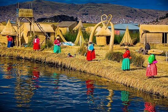 Local women waiting for visitors at the edge of the totora reeds island in the Uros Islands, Peru