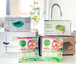 A selection of the best tofu presses on a kitchen counter