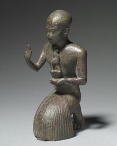 A priest making a ritual gesture...part of Doing Things, probably offering