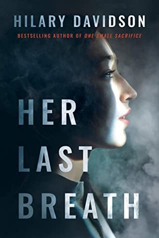 Book cover for Her Last Breath by Hilary Davidson, showing a face half in dark and half in light with smoky background