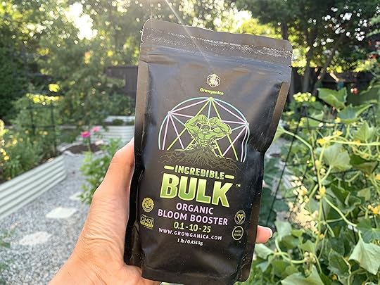 one black bag of vegan fertilizer in a green leafy background