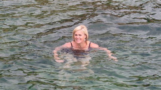 Wild swimmer and author of The Wide, Wide Sea, Anna Wilson, swimming in the sea