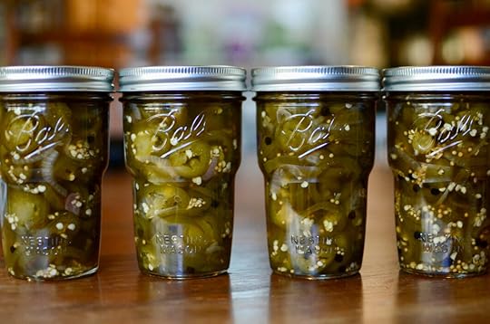 Four Ball® Nesting Pint Jars filled with dark green maple pickled jalapeños.