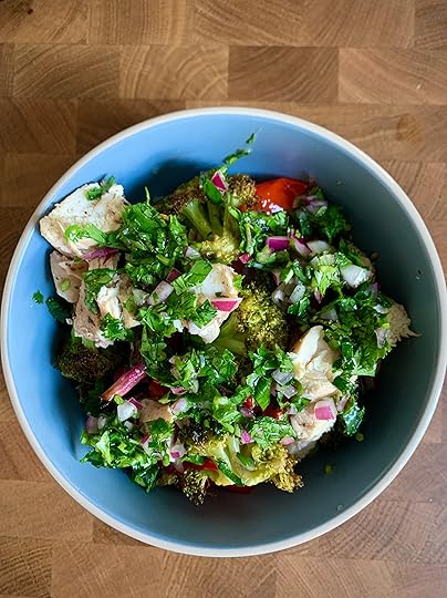 quinoa bowl with chicken and roasted vegetables with chimichurri drizzled on top.