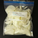 frozen sliced onions in a ziptop freezer bag.