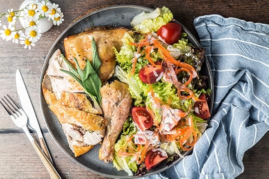 roasted spatchcock chicken recipe on a platter with salad