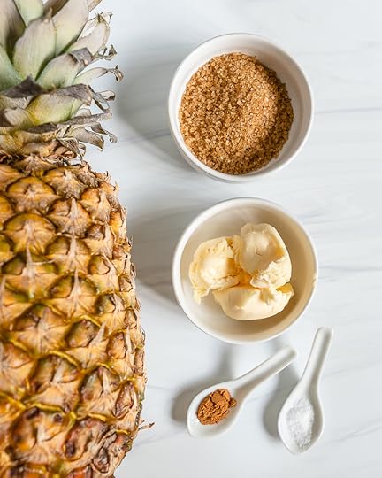 ingredients for grilled pineapples including pineapple, brown sugar, cinnamon, plant based butter, and salt