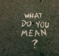 What do you mean? written in chalk on pavement