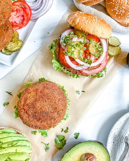 Southwest Black Bean Burger with various ingredients in a background